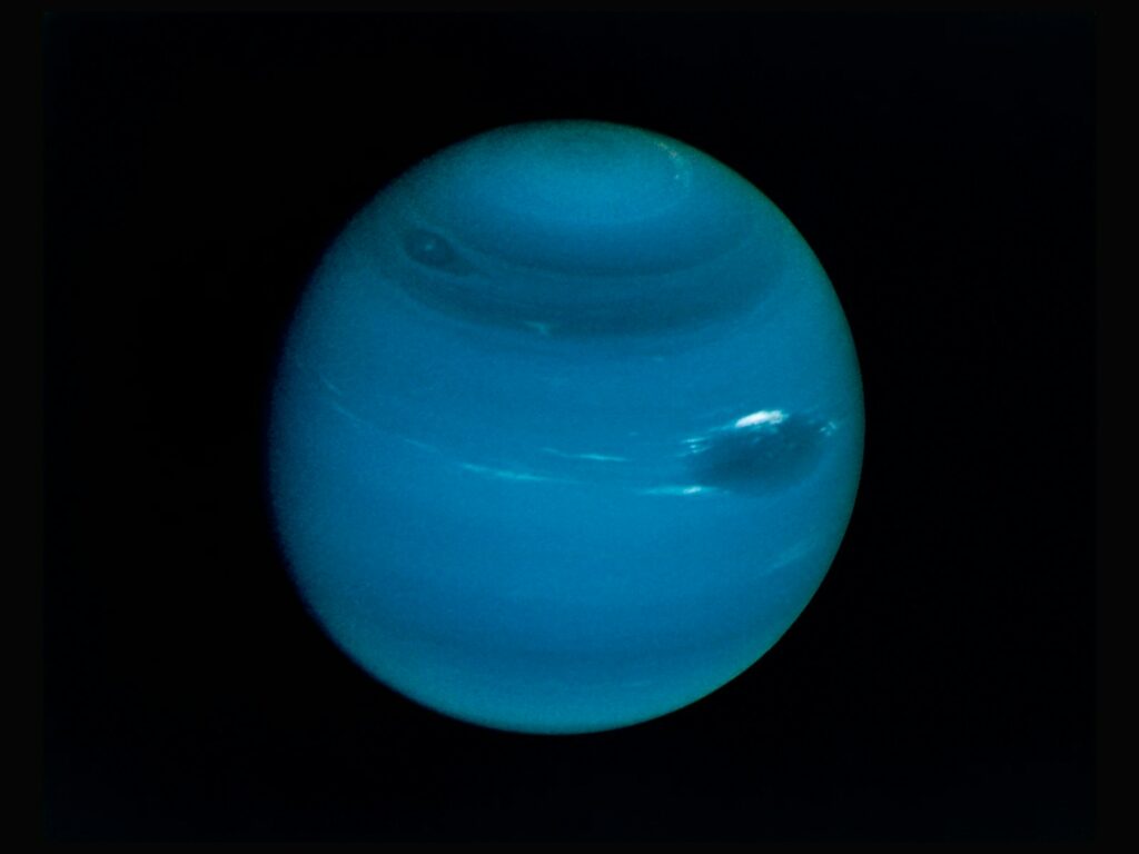 Neptune on a black background